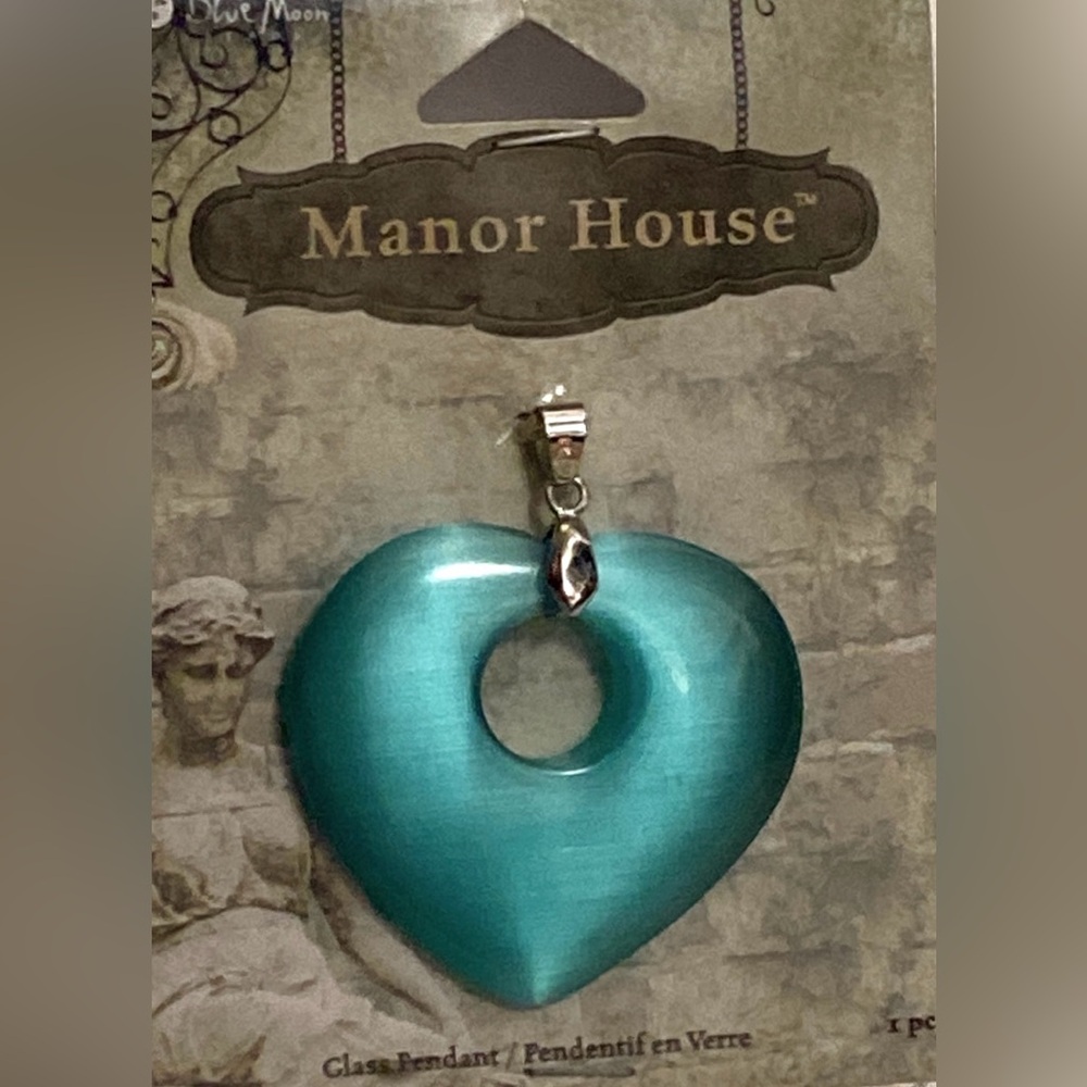 Manor House "Blue Moon" teal glass heart-shaped pendant.